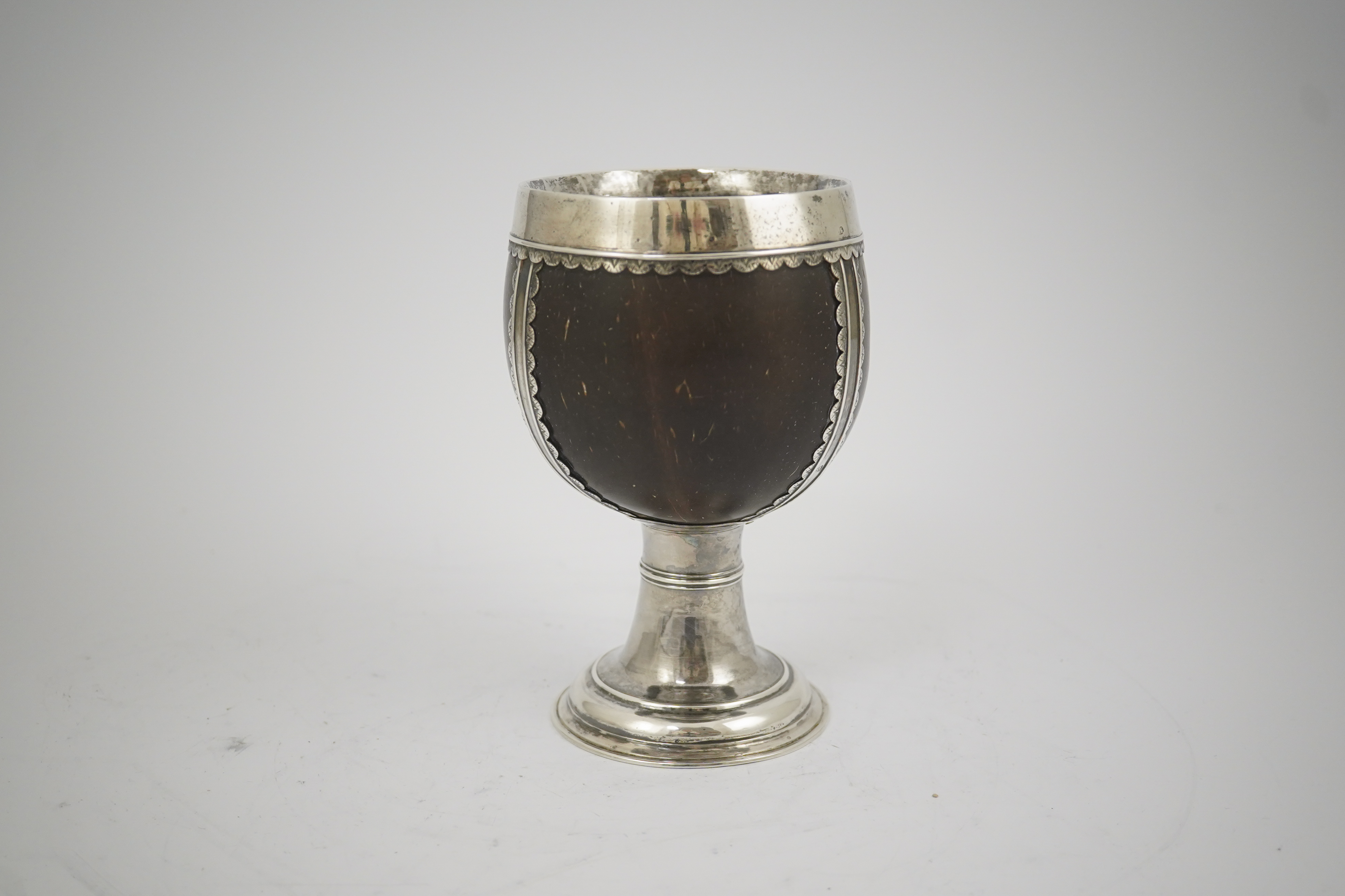 A late George I? silver mounted coconut cup, makers mark only, possible Samuel Eaton, London